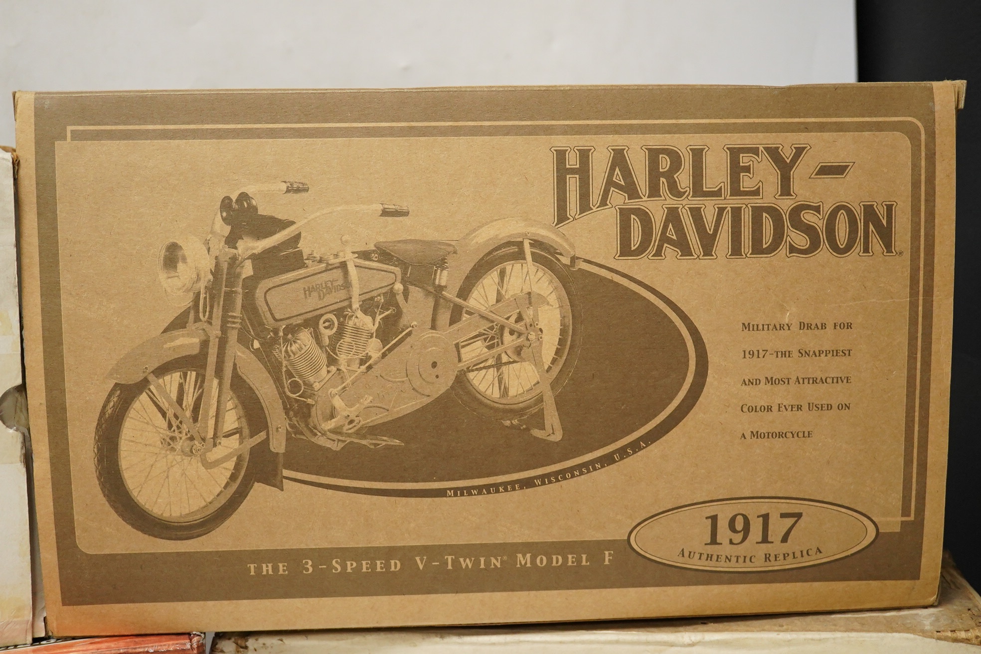 Four boxed diecast motorcycles by Franklin Mint, Guitoy, etc.; a Guitoy 1:6 scale model of an Indian Chief 348 (1948), a 1:6 scale Harley Davidson 1917 bike in military drab, a 1:24 scale Harley Davidson 1936 ‘45’ ES and